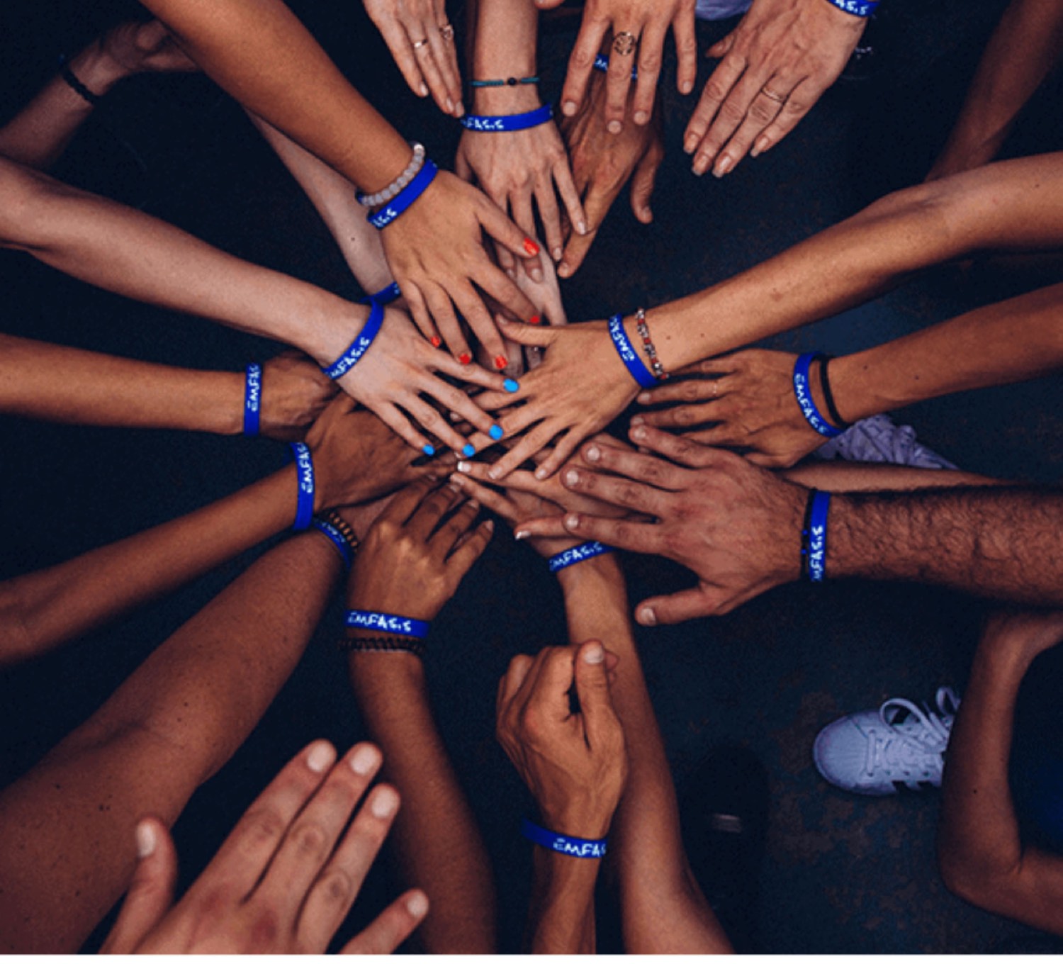 Community members' hands joined together